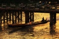 Boat Pass The Wood Bridge in Sunset, Nyaungshwe, Myanmar