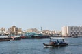 Boat with passangers crossing Dubai Creek river Royalty Free Stock Photo