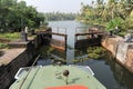 Boat passing a barrage on the way from Kollam to Alleppey