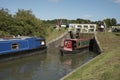 Boat passing through a lock on an English canal UK Royalty Free Stock Photo