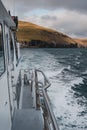 Boat on a peaceful journey through a vast expanse of blue ocean