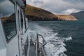 Boat on a peaceful journey through a vast expanse of blue ocean