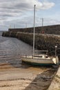Boat at Pier and beach in Galway Bay Royalty Free Stock Photo