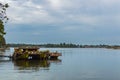 Boat-pier on a river at sunset time Royalty Free Stock Photo