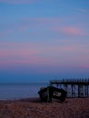 Boat and Pier at Sunset on the English Channel