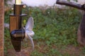 Boat propeller engine element on a green backyard background. Royalty Free Stock Photo