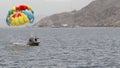 A Boat Pulls Colorful Para Sailing At The Blue Sea. Eilat 2017
