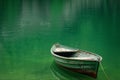 Boat in a quiet cove of a green lake