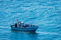 Boat racing across open ocean water. Boat speeding in the sea. Minimal nature photography. Beach view of maritime transportation. Royalty Free Stock Photo