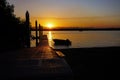 Boat ramp slipway with sunset over the ocean. Royalty Free Stock Photo
