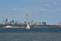 Boat with red rimmed spinnaker sails Toronto harbour