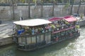 Boat with restaurant docked on Seine River, Paris, France