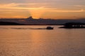 The boat returns to the pier at sunset, which sets in clouds. Lake VesijÃÂ¤rvi. Lahti. Finland