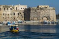 Boat returns to port with the castle