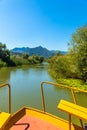 Boat ride aft along a narrow tropical river