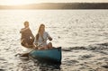 Boat ride and sunshine. a young couple rowing a boat out on the lake. Royalty Free Stock Photo