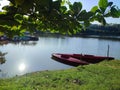 Boat riding on a lake in the park at afternoon.