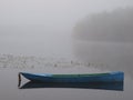 Boat on the river in the morning mist Royalty Free Stock Photo