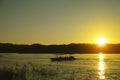 Boat on river in sunset time Royalty Free Stock Photo