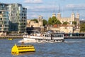 Boat on the river Thames with a view of the Tower of London