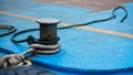 Boat rope tied up on bitt Large steel bollard at the harbour Royalty Free Stock Photo