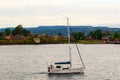 Boat sailing along Nakholmen island country cottages Norway Royalty Free Stock Photo