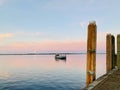 A boat sailing away from the shore