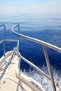 Boat sailing blue calm ocean sea bow railing Royalty Free Stock Photo