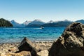Boat sailing on a lake with mountains in the background. Neuquen, Argentina Royalty Free Stock Photo