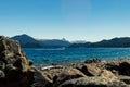 Boat sailing on a lake with mountains in the background. Lake Nahuel Huapi. Neuquen, Argentina Royalty Free Stock Photo