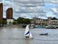 Boat sailing over the Thames River near Chelsea Harbour, London