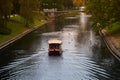 A boat sailing in the park near Latvian National opera and ballet theater in Riga, Latvia