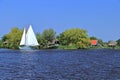 Sailing Ship and Traditional Houses at De Alde Feanen National Park, Friesland, Netherlands