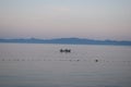 Boat sailing on a sea in the dawn