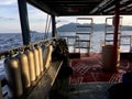 Boat sailing in thai islands with scuba diving tanks on one side Royalty Free Stock Photo