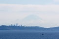 Boat Sailing Under Mount Rainier on a Clear Day Puget Sound Pacific Northwest Washington State