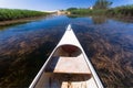 Boat sails along a quiet backwater of the river between the reeds Royalty Free Stock Photo