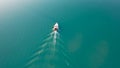 The boat sails on Lake Balkhash at sunset. Royalty Free Stock Photo