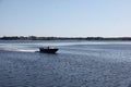 The boat sails on the river in the morning