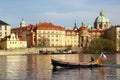 Boat sails on Vltava river in central Prague Royalty Free Stock Photo