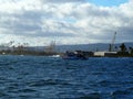 Boat with scuba divers practice in front of Kaka`ako Waterfront Park