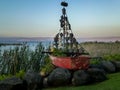 Boat sculpture with sail and plaster masks of faces ,Sea of Galilee, Israel