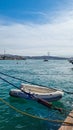 Boat in the sea near the pier. Fatih Sultan Mehmet Bridge across the Bosphorus in Turkey Royalty Free Stock Photo