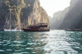 Boat on the sea with rocks on background Royalty Free Stock Photo