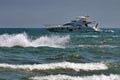 Seascape with boat on the sea. Waves show. Summer, sun, beach, holiday, fun and blue sky - Black Sea, landmark attraction, Romania Royalty Free Stock Photo