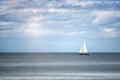 Boat in the sea. Sailing ship luxury yacht with white sails in the sea. Royalty Free Stock Photo