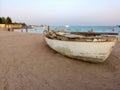 Boat by the sea, sand, ocean, sunset, holiday, vacation, beach, love, honeymoon, romance , romantic, rowing Royalty Free Stock Photo