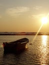 Boat on sea at sunset