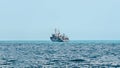 Boat or ship navigating on blue Black Sea water, cargoboat