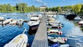 Boat, ship and sail docked near at the wooden pier in  harbour. Royalty Free Stock Photo